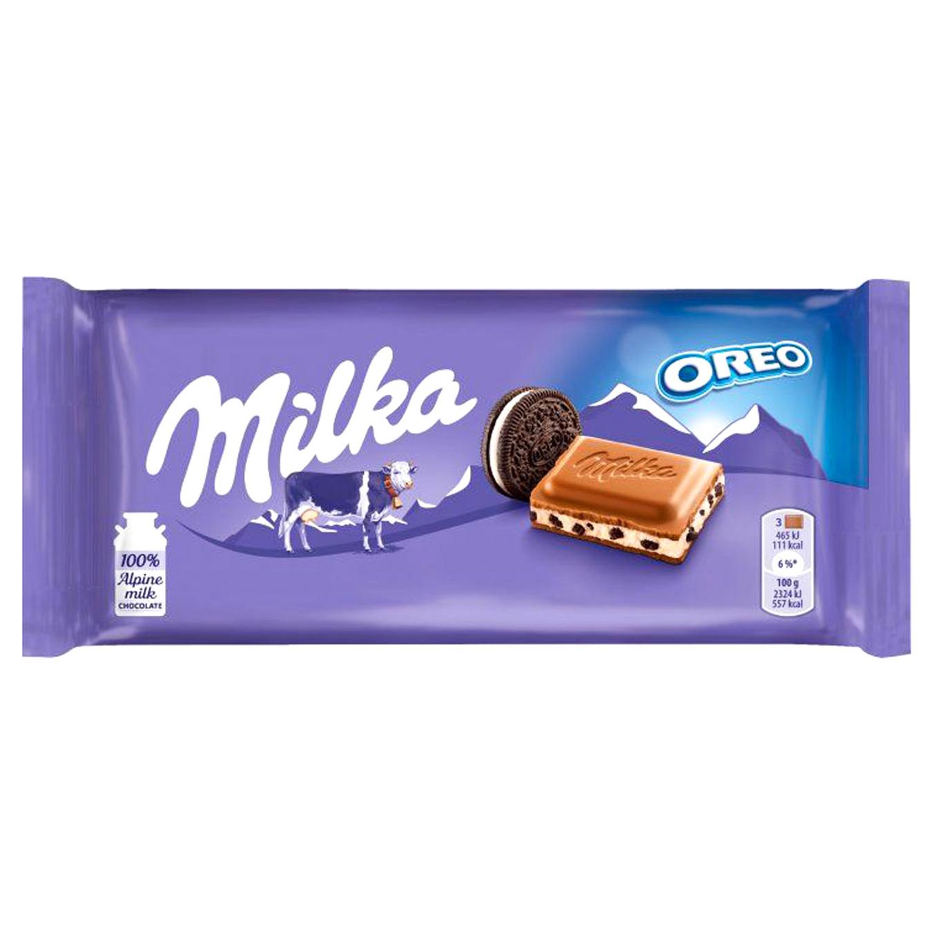 Шоколад молочний Milka з молочною начинкою зі смаком ванілі та шматочками печива Oreo 100г — фото продукту