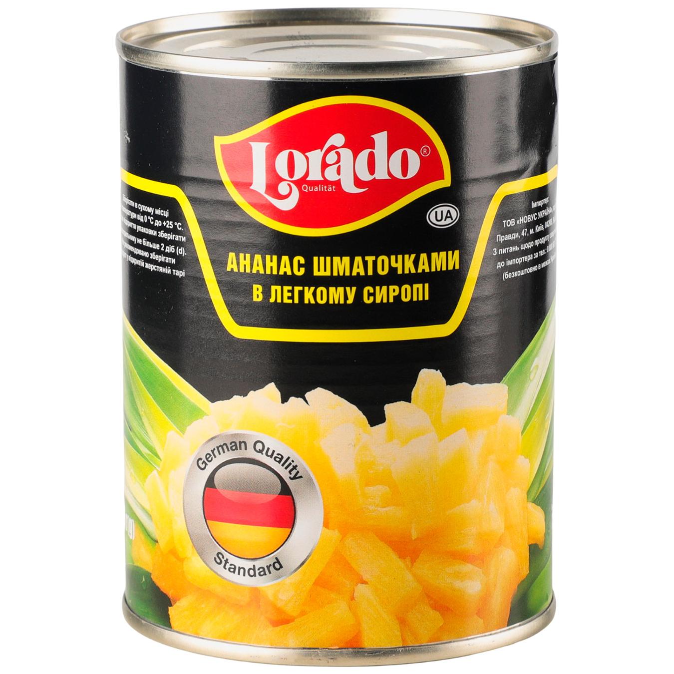 Ананаси Lorado шматочками у легкому сиропі 580мл — фото продукту