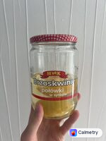 Половинки персиків у сиропі